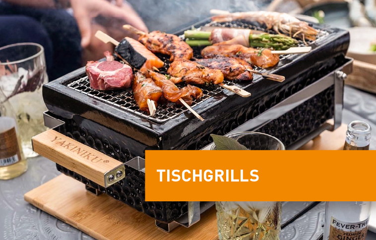 Holzkohle Tischgrill mit Grillgut drauf